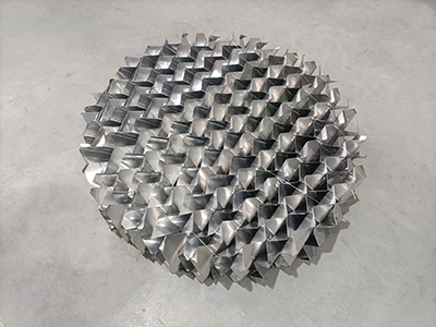 How Does the Surface Energy of Structured Packing Affect Wettability?